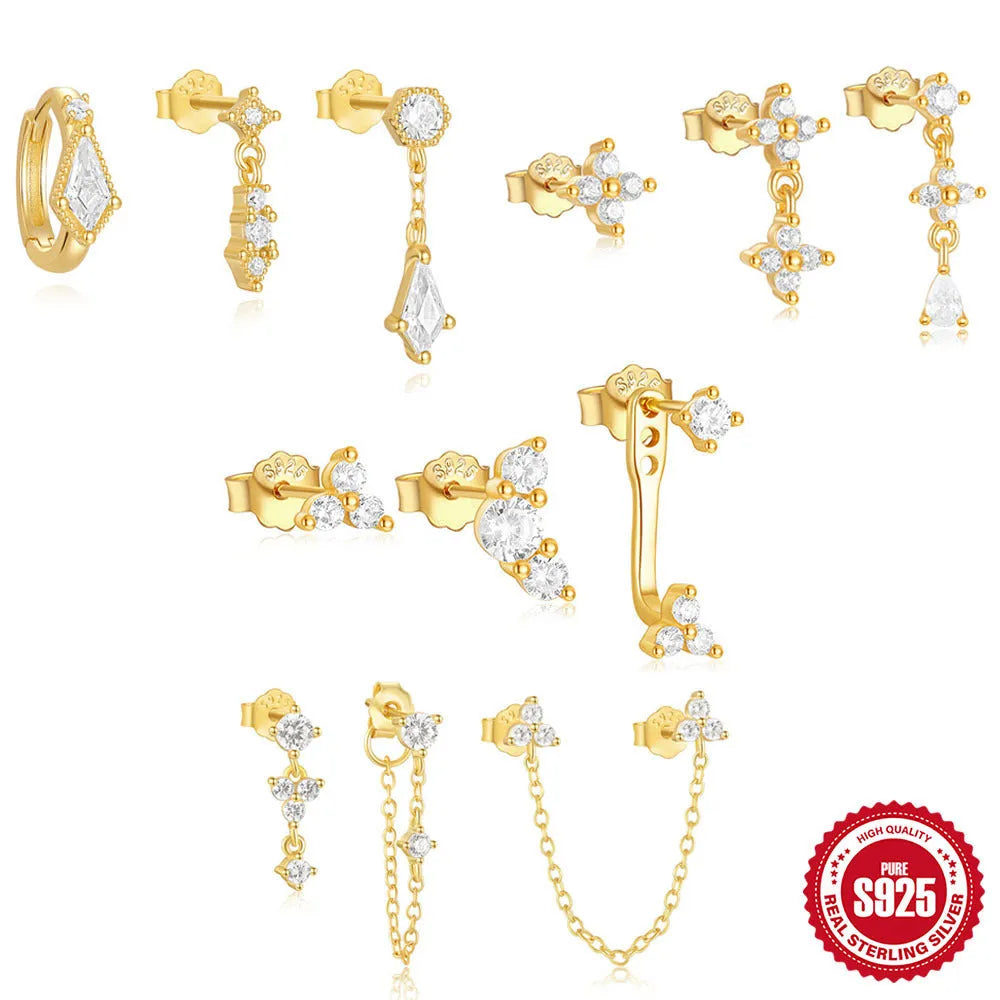 S925 sterling silver geometric earring set with three studs in gold tone on a flat surface.