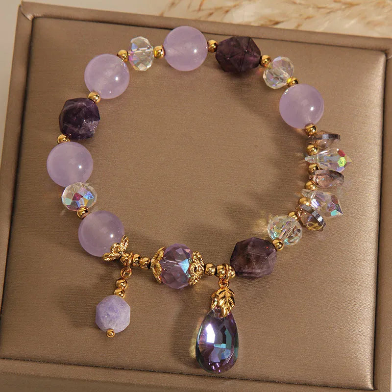Lavender purple crystal water drop bracelet for children on display, retro original design