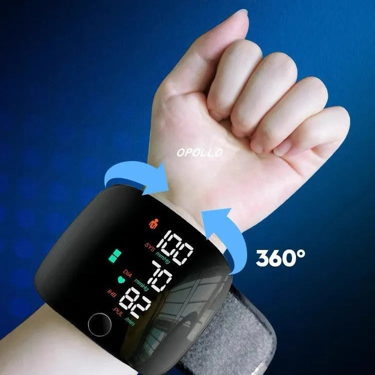 Black wrist blood pressure monitor with USB charging cable and multilingual voice options