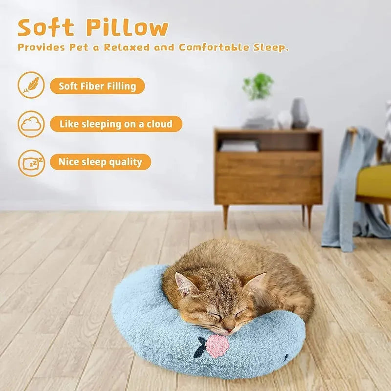Small half-donut shaped pet pillow in blue faux fur, showing quilted texture and plush filling.