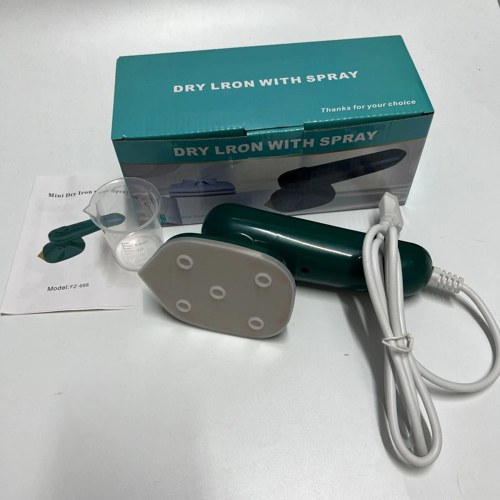 Handheld portable garment ironing machine in dark green with large titanium panel, UK plug