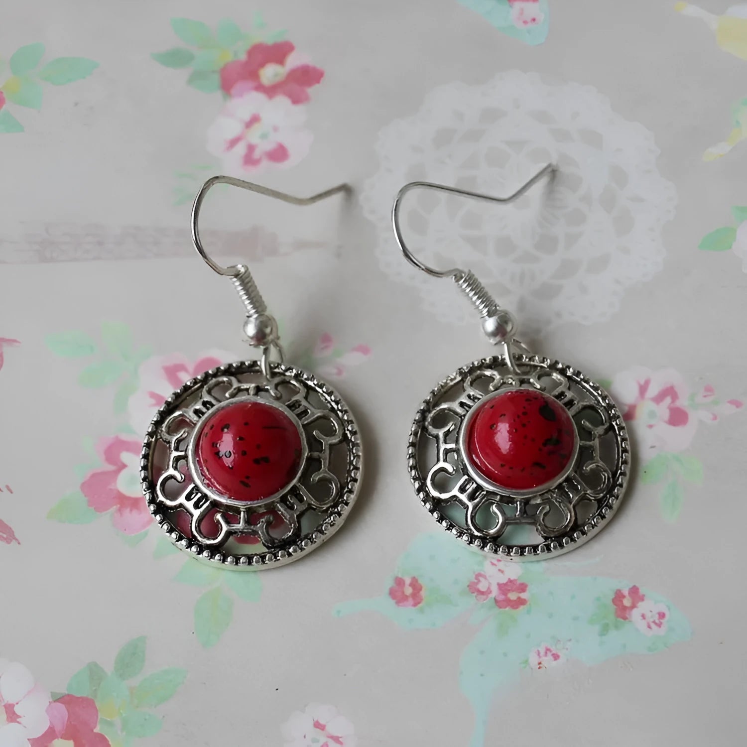 Handmade ethnic earrings with a Tibetan silver geometric flower disk design and turquoise stones.