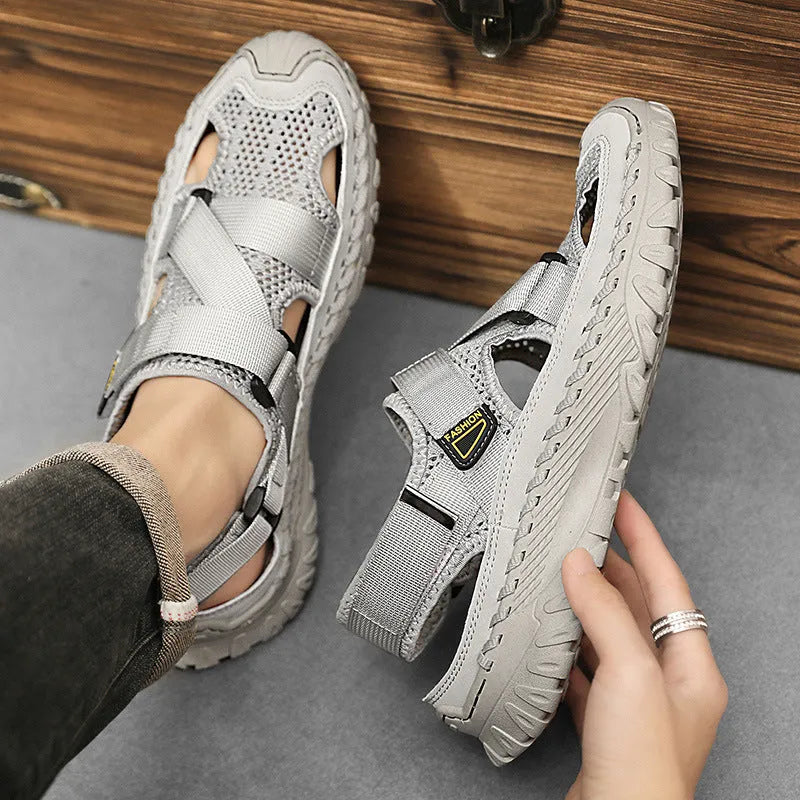 Men's summer casual sandals with hollow mesh surface, genuine leather upper, and elastic band in gray colour