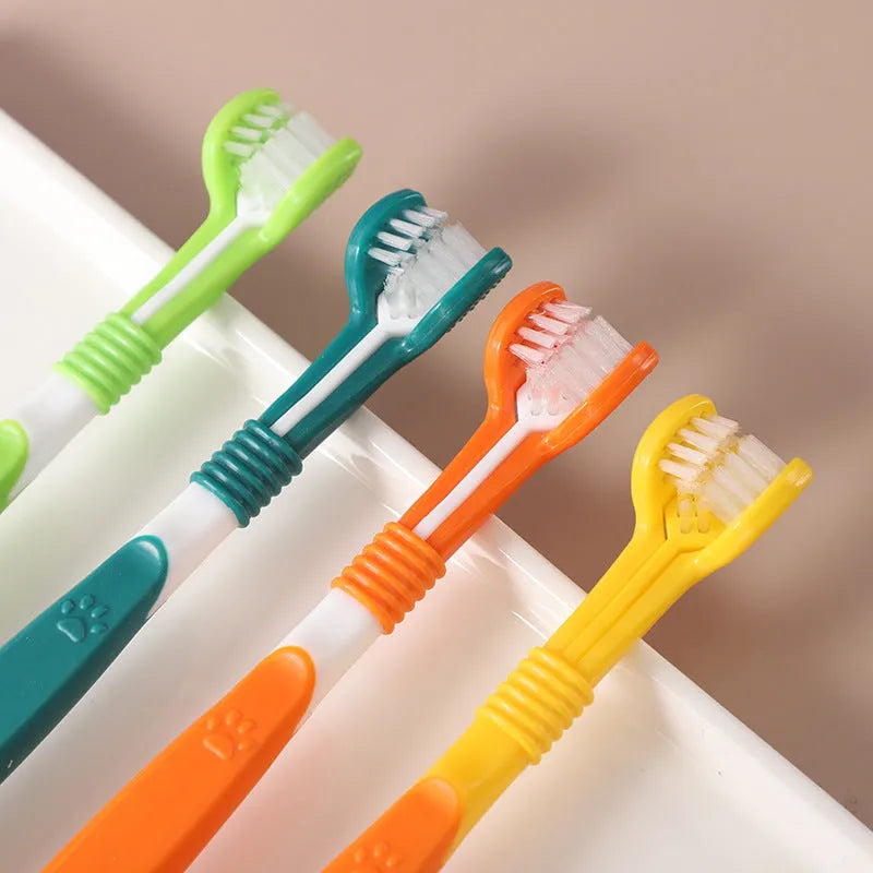 Pet toothbrush with plastic handle and nylon bristles in multiple colour options on sealed bag packaging