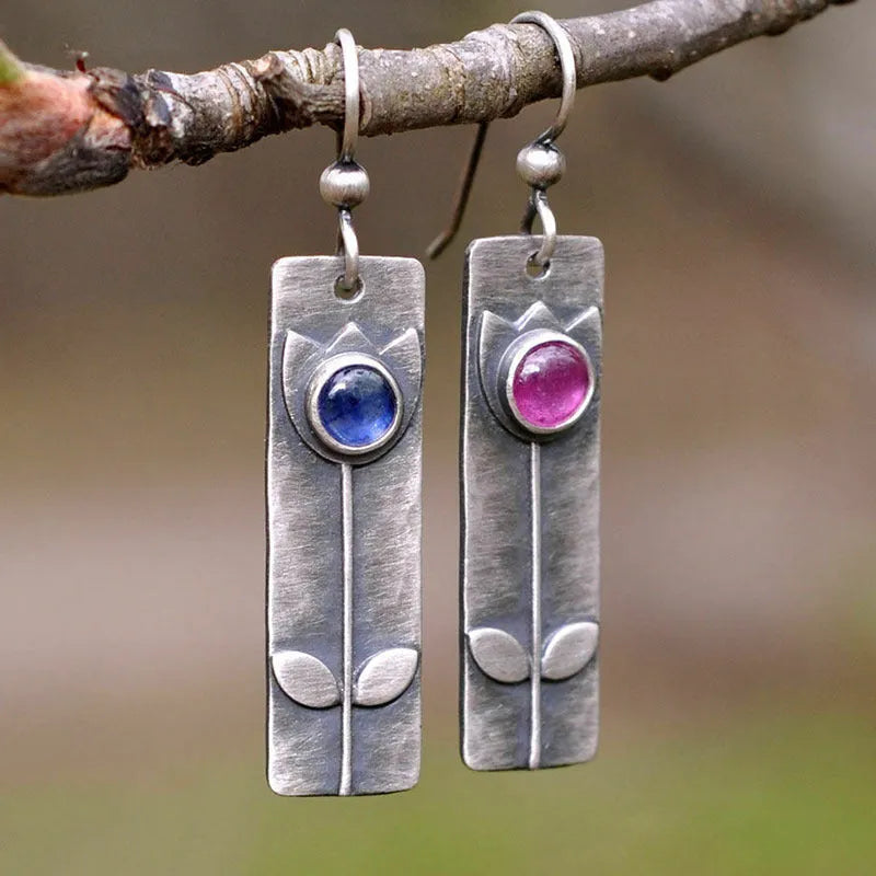 Antique finish red sapphire geometric earrings with ellipse shapes and electroplated metal construction