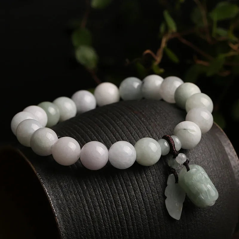 Natural jade bracelet with geometric beads showing Maitreya Buddha, double apple, and money bag symbols