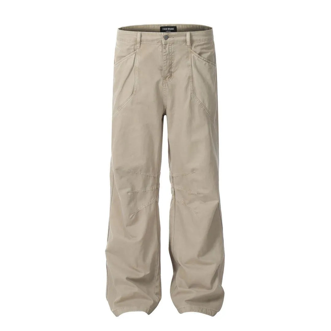 Men's brown straight-leg cotton trousers showing high-waist design with wide leg opening and zipper fly