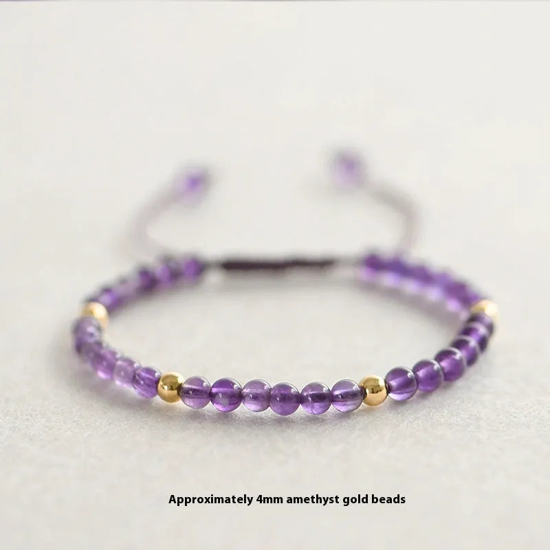 Handmade 4mm natural amethyst bracelet with 14K gold plated accents on a white background