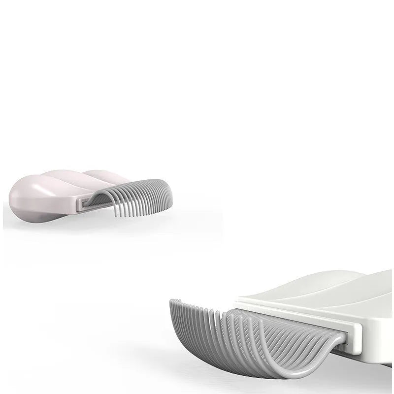 Paw Soft deshedding grooming brush for cats and dogs on a white background.