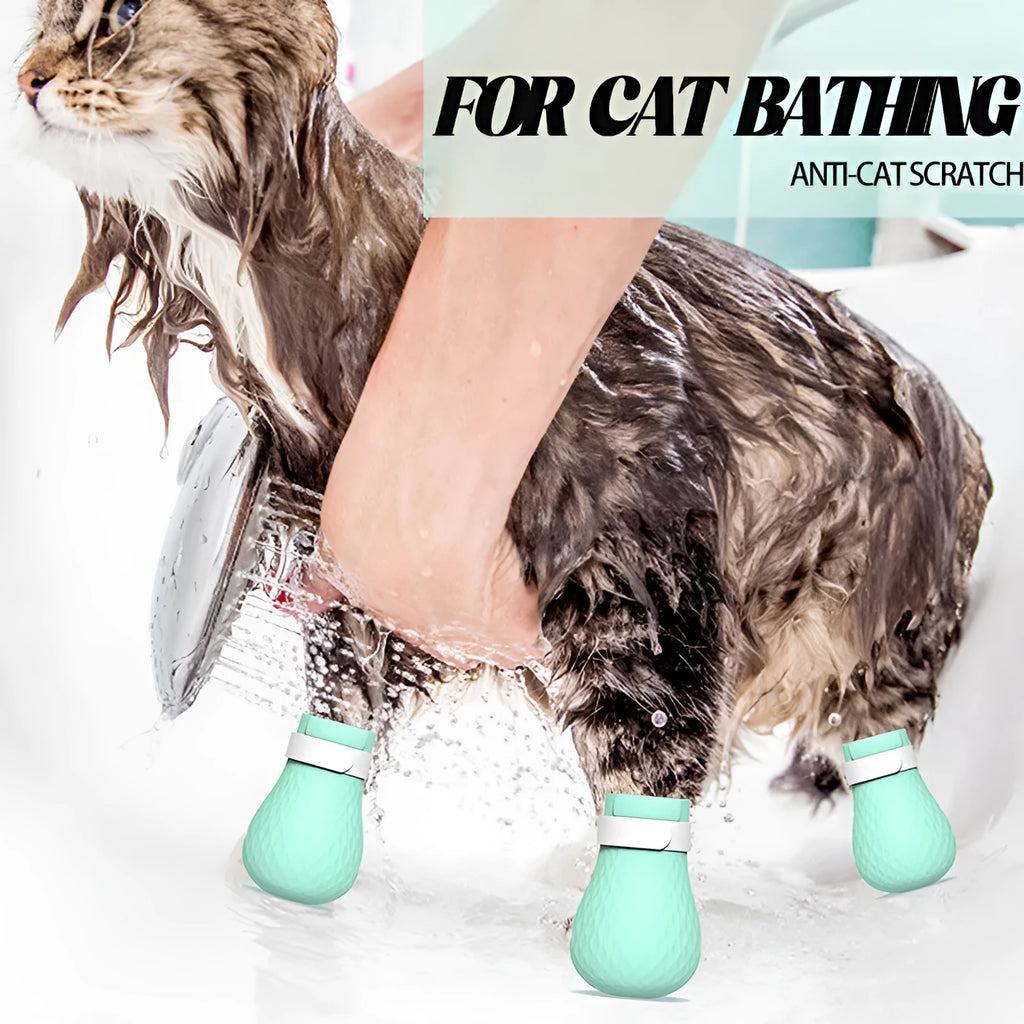 Four green silicone cat foot covers for scratch protection during pet washing and medicine administration