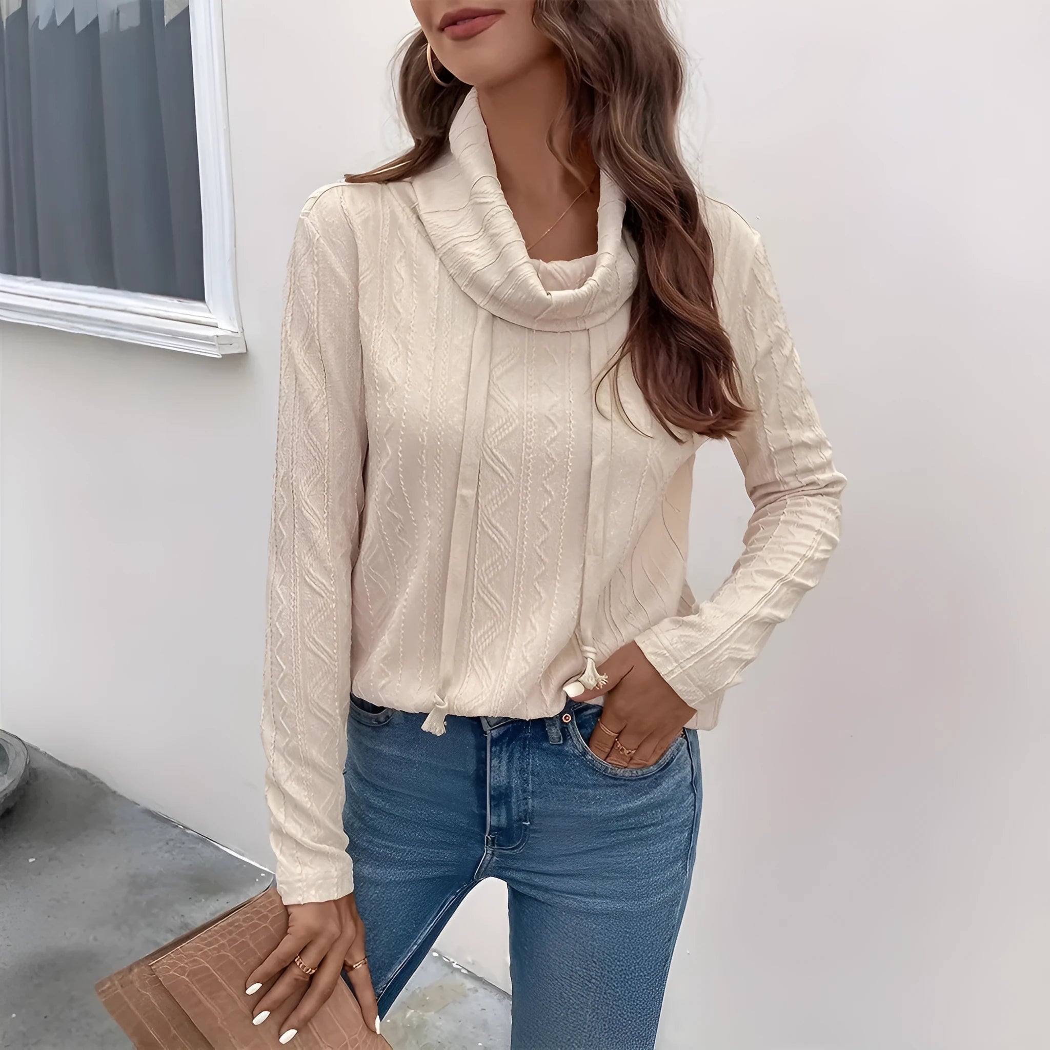 Apricot coloured women's hooded pullover sweater with long sleeves and drawstring adjustment