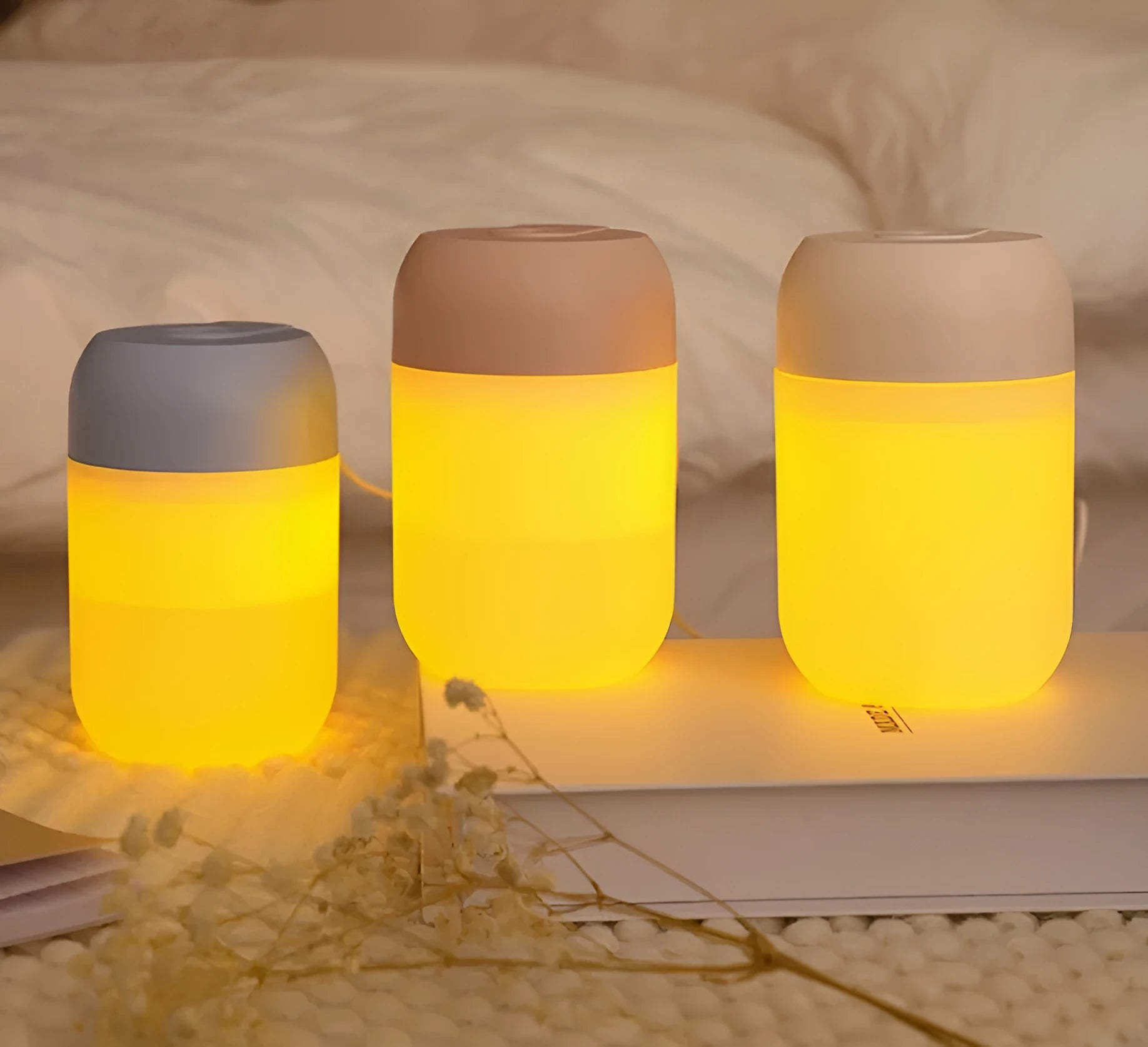 Small white cylindrical USB-powered humidifier with aromatherapy function on a desk