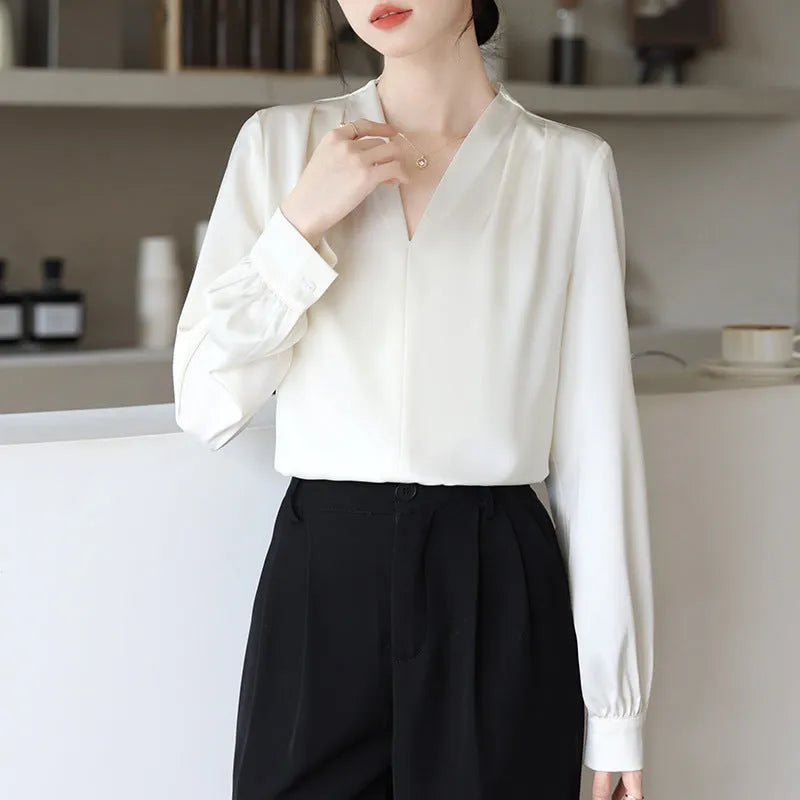 Women's long sleeve solid blue satin shirt with slim fit and 3D stitching, front view