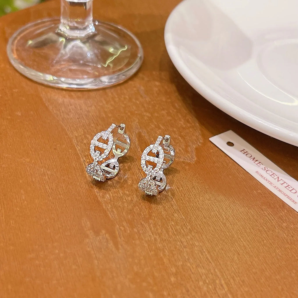 Women's thick gold plated diamond earrings in silver, gold and rose gold colours on copper base with electroplated finish