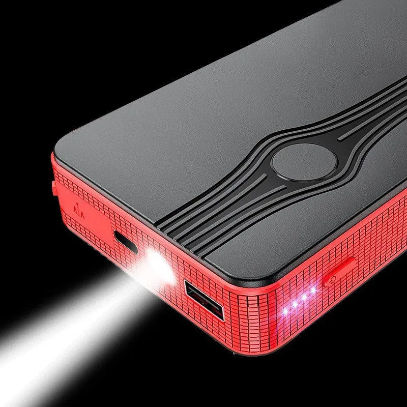 Red K4-E automobile emergency jump starter power bank with data cable, compact rectangular design.