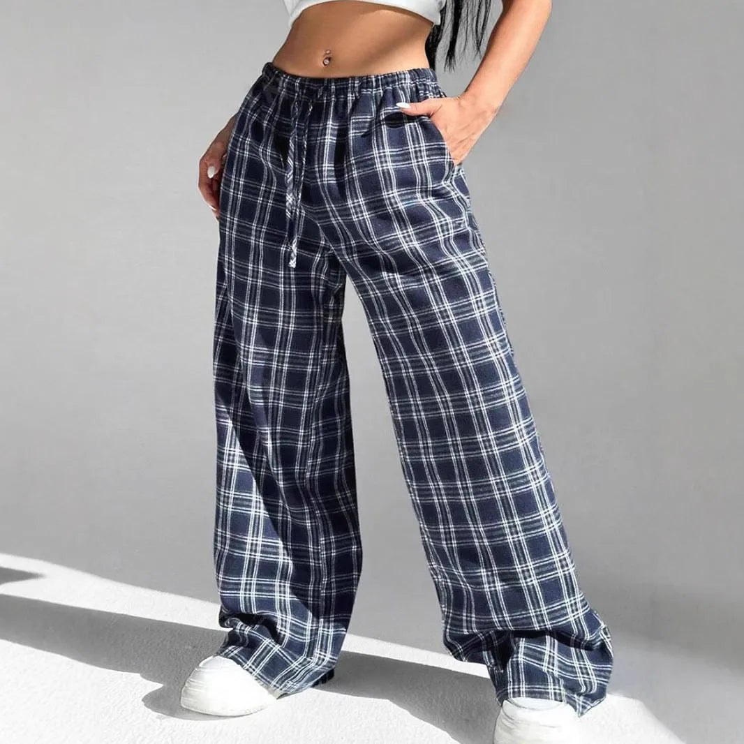 Women's red casual loose trousers with drawstring waist and plaid patch pockets laid flat.
