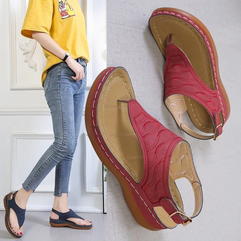 Women's casual wedge heel sandals in black with an adjustable back strap buckle.
