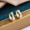 Geometric copper earrings with 14K yellow zircon treatment, contemporary jewellery design
