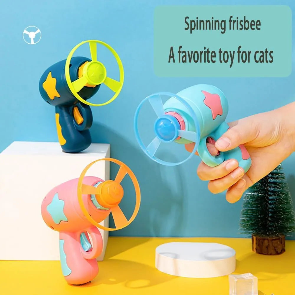 Blue interactive cat toy gun with plastic frisbee on launcher head