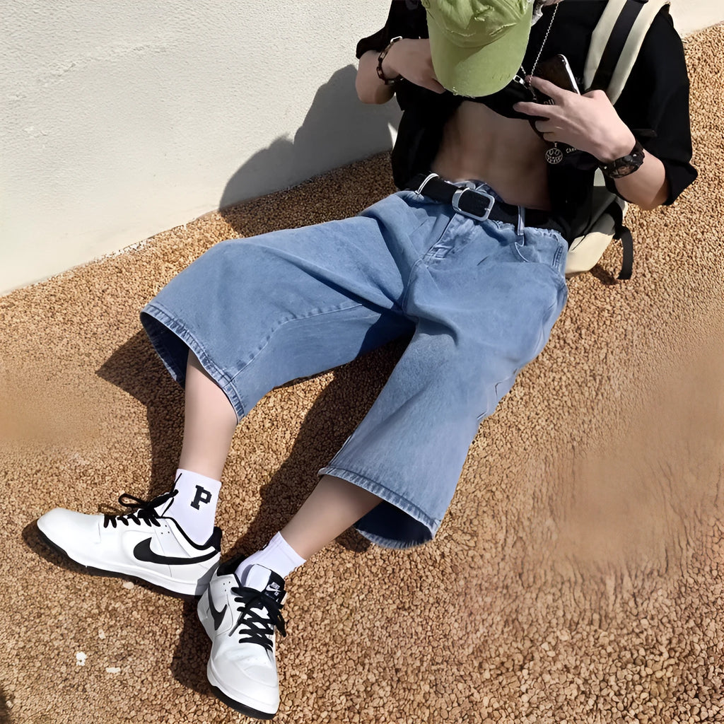 Men's high-waisted, cropped blue denim-style pirate shorts with a straight leg and zipper fly.