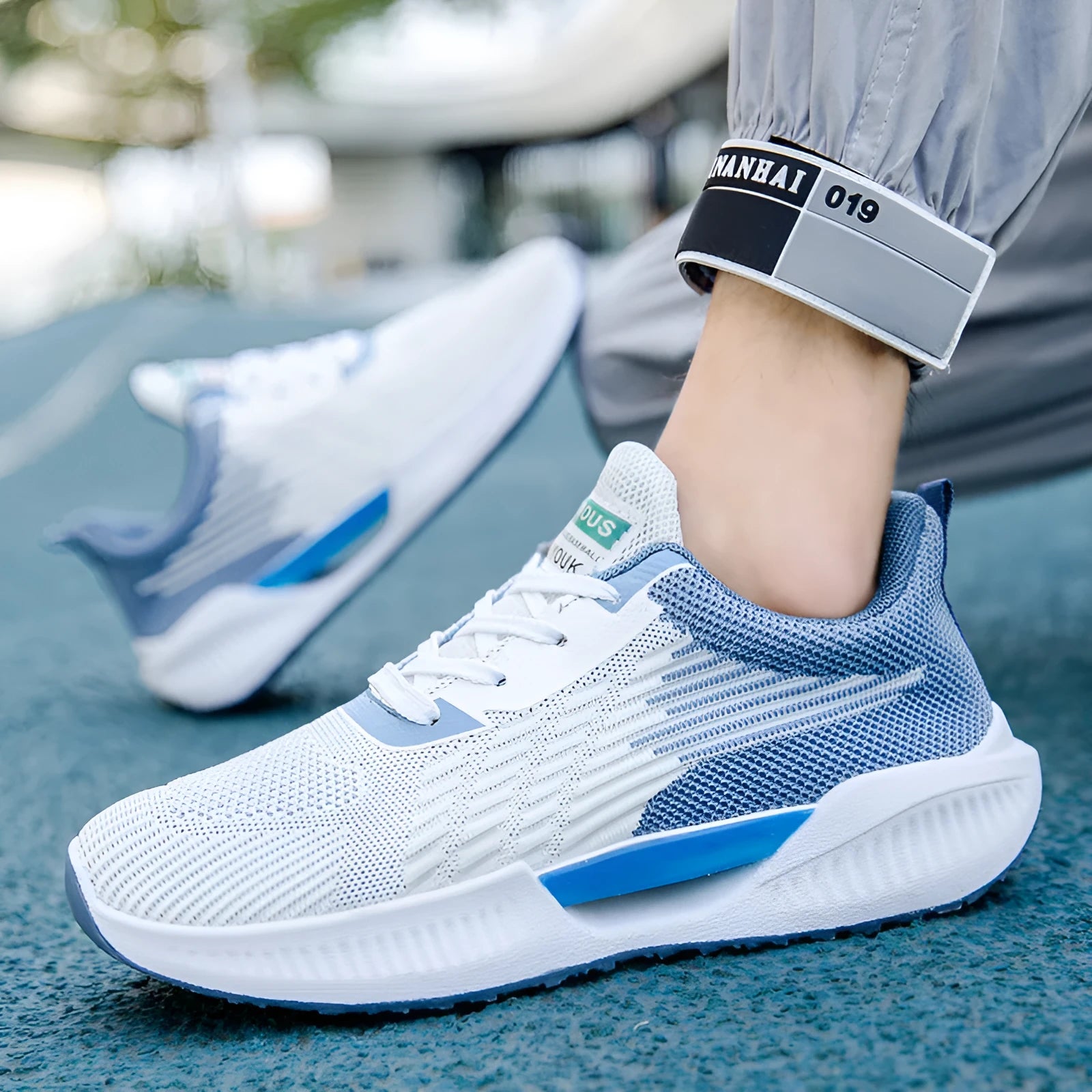 Men's blue casual mesh shoes with round toe and cloth upper on a white background.