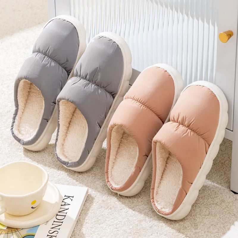 Blue winter house slippers with artificial leather upper, thick rubber sole, and plush lining.