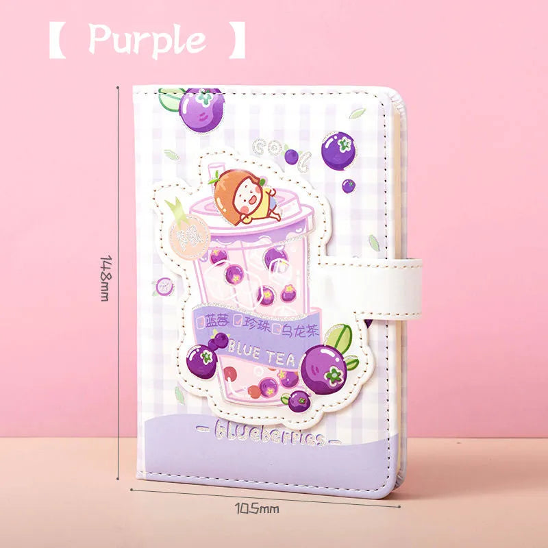Cute magnetic buckle notebook with heart design in pink, yellow, green, and purple colours on white background