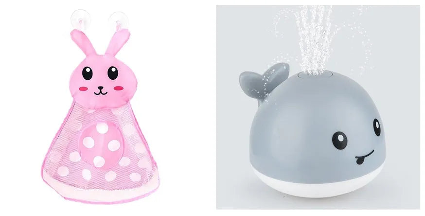 White and blue electric whale bath toy spraying water with lights on a base.