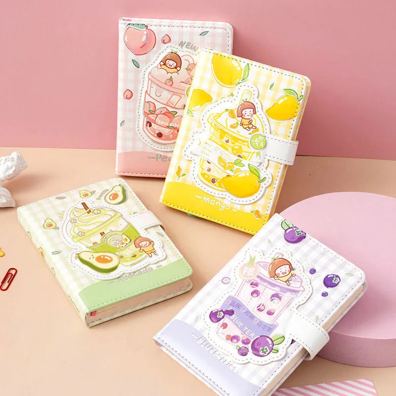Cute magnetic buckle notebook with heart design in pink, yellow, green, and purple colours on white background