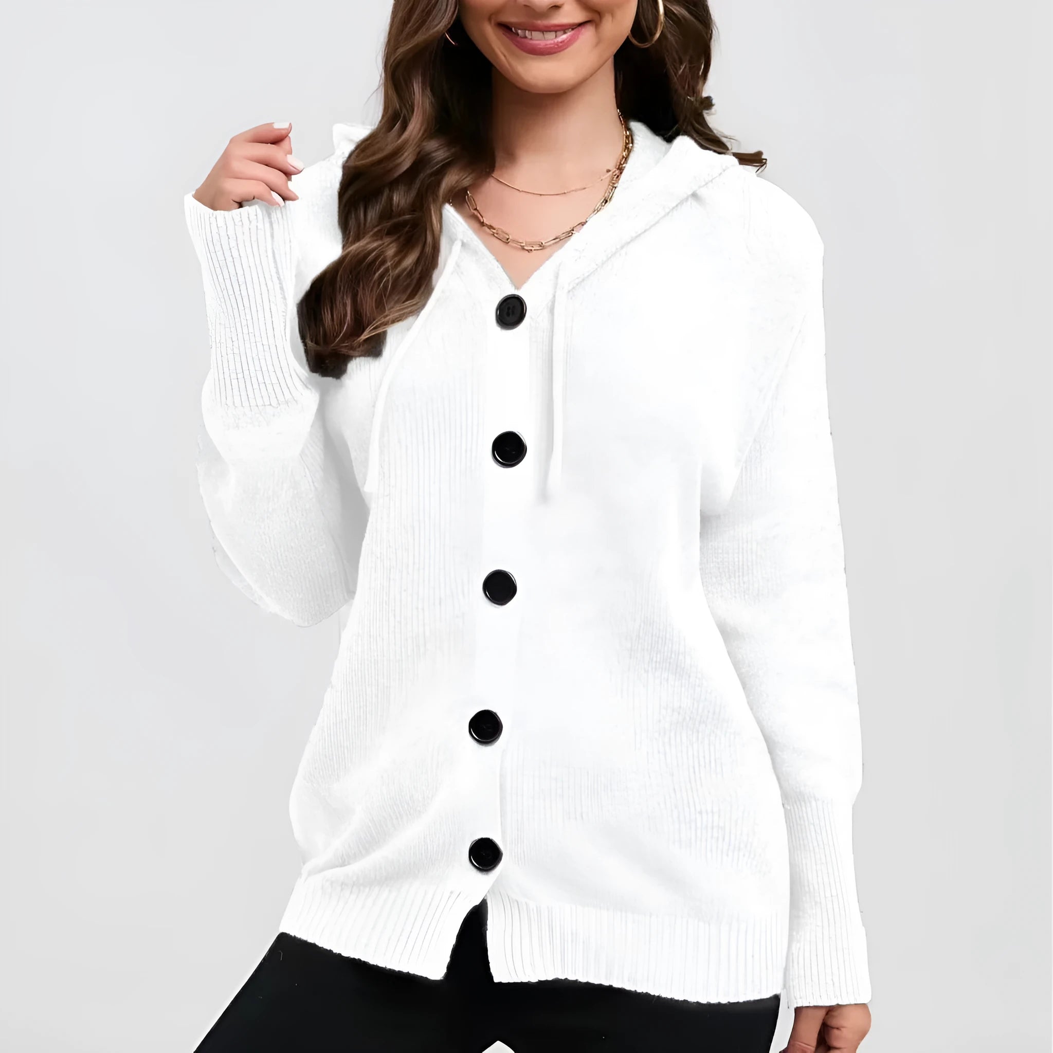 Women's loose fit hooded cotton cardigan sweater in a solid colour with long sleeves.