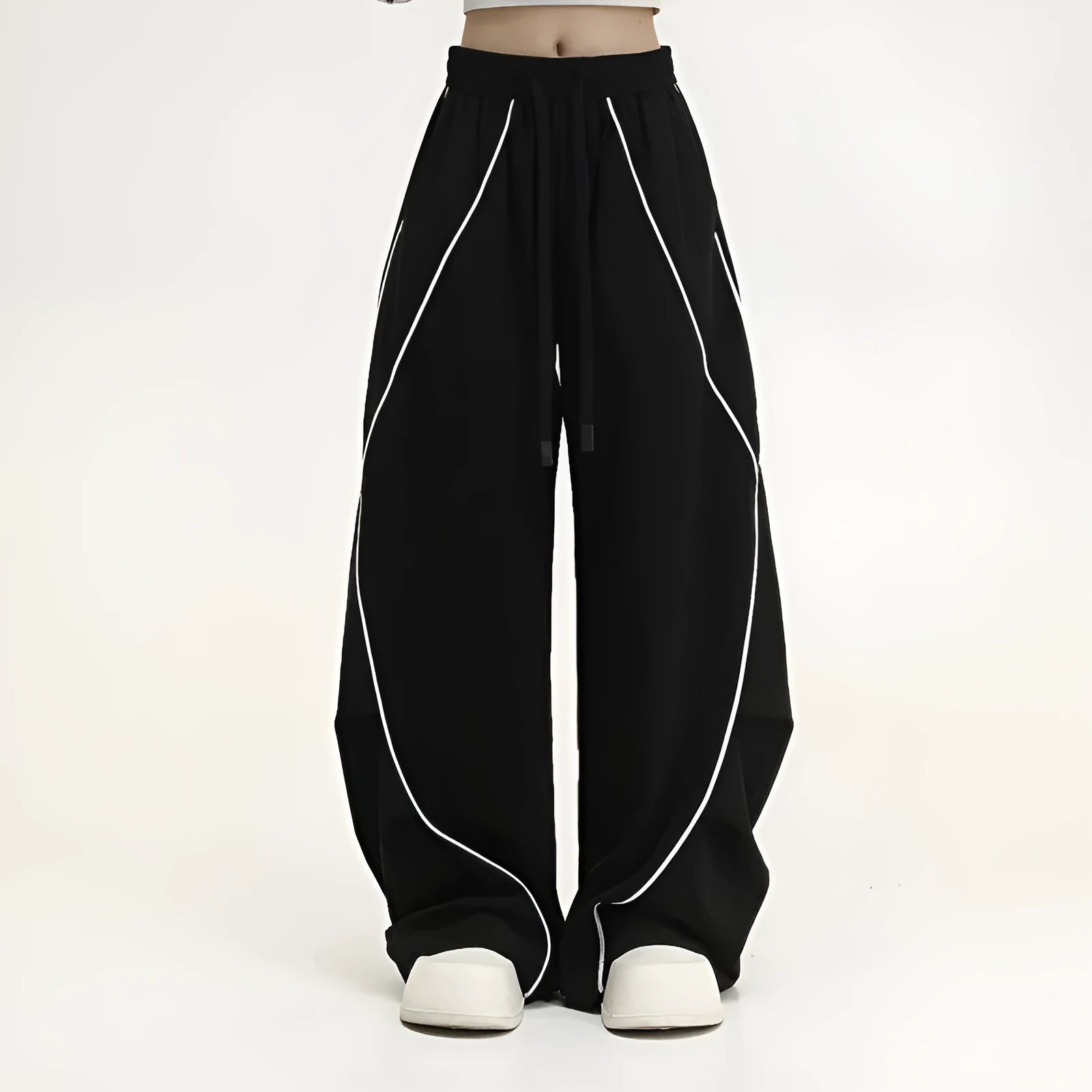 Black pleated wide-leg sports trousers with vertical stripe pattern and mid waist