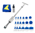 Metal automotive dent repair tool with T-shaped hammer and blue adhesive pads on car body panel