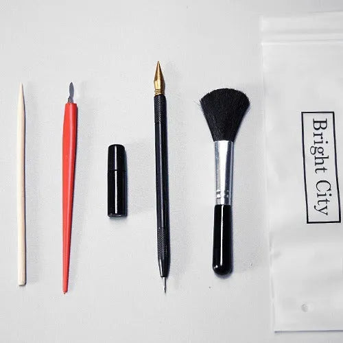 Creative scraping painting tool set with brushes, pens, scrapers, and photo frames for scratch art projects