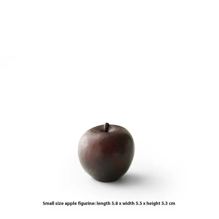 Retro Chinese style ceramic simulation apple ornament for desktop decoration on a wooden surface.