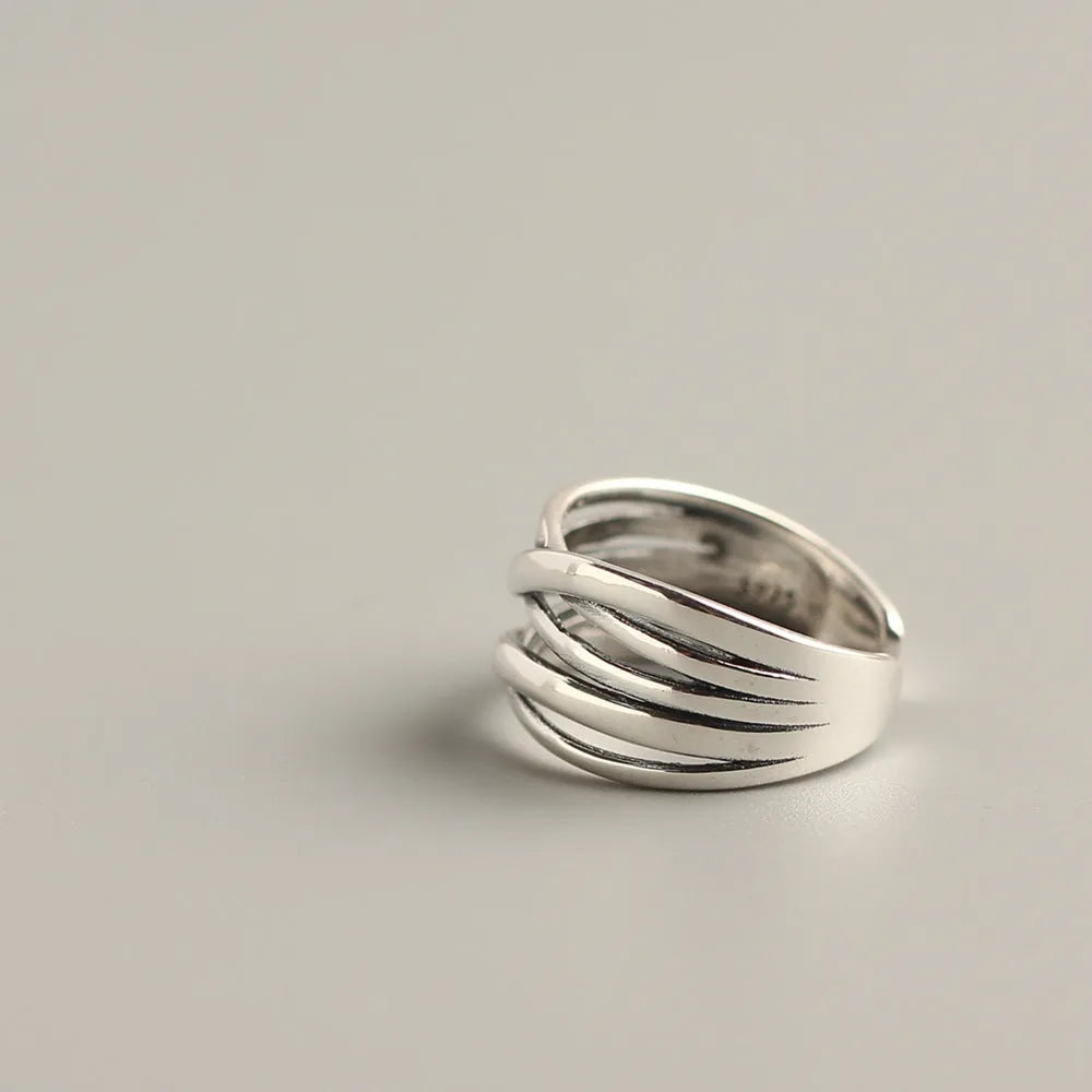S925 sterling silver vintage weave ring for women, retro silver finish with textured weave pattern on plain background