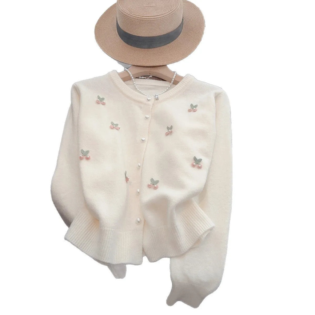 Cashmere blend slim fit cardigan sweater coat with beaded decoration on a hanger.