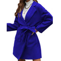 Minimalist long sleeve lapel coat with an adjustable belt and split front in a loose fit.
