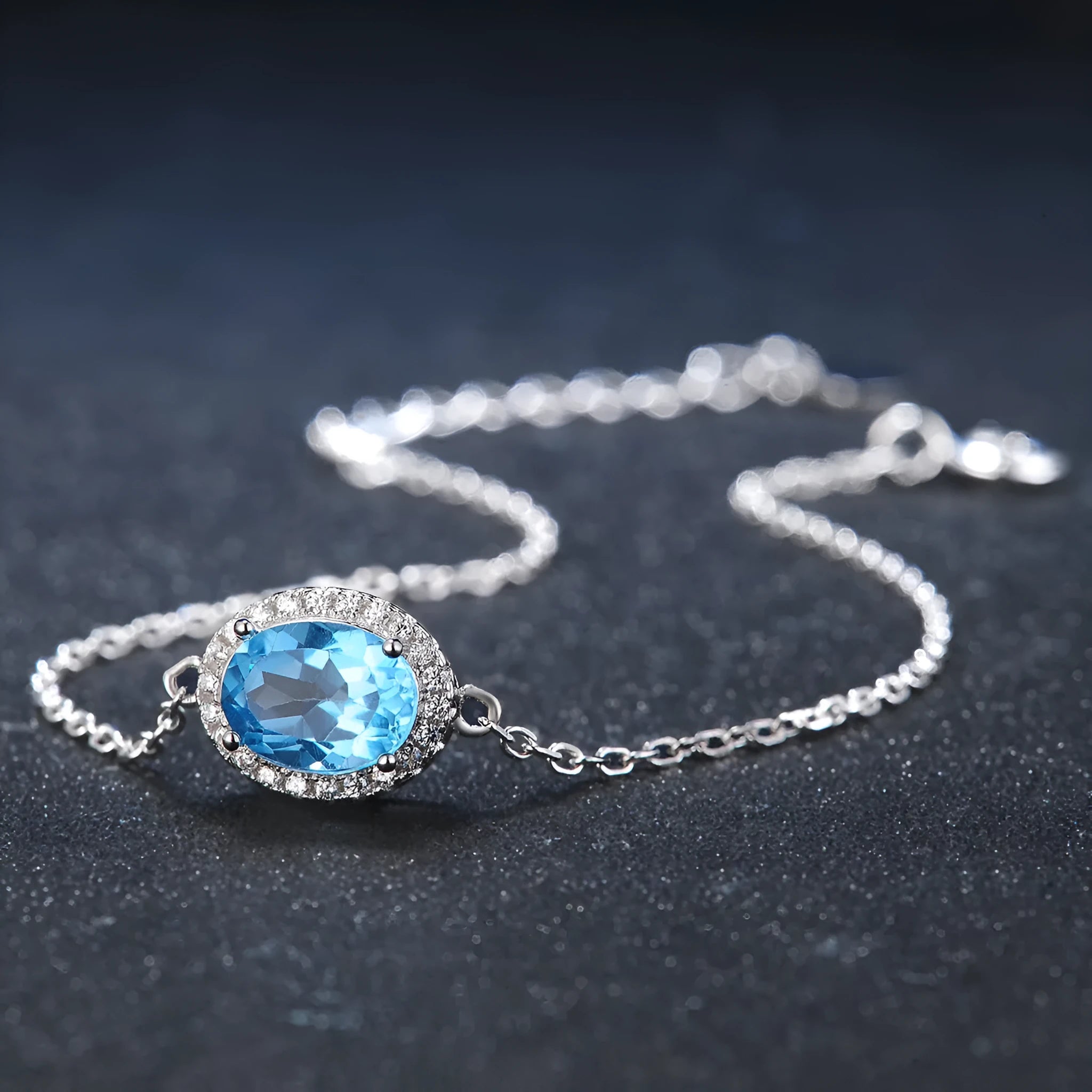 925 sterling silver geometric jewellery set with blue topaz stones including earrings, ring, bracelet and necklace