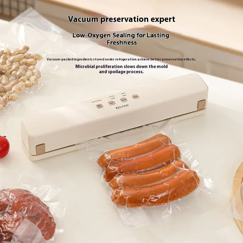 Off-white plastic vacuum sealing machine for home food packaging on a kitchen counter