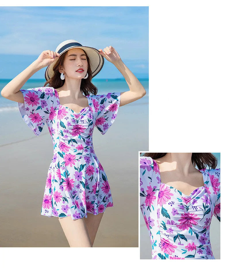 Women's one-piece slimming dress-style swimsuit with blue floral printed pattern on polyester fibre fabric