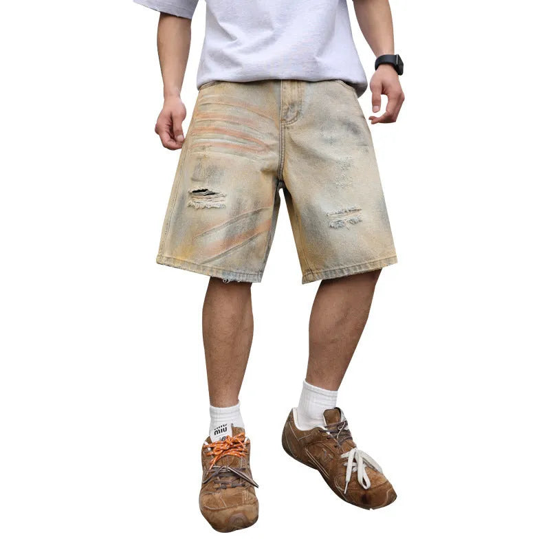 Men's light blue washed ripped straight-leg denim shorts on model front view