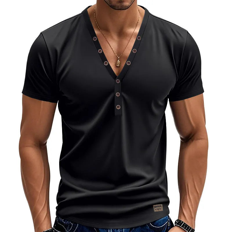 Man wearing a loose grey V-neck T-shirt with button detail on the front.