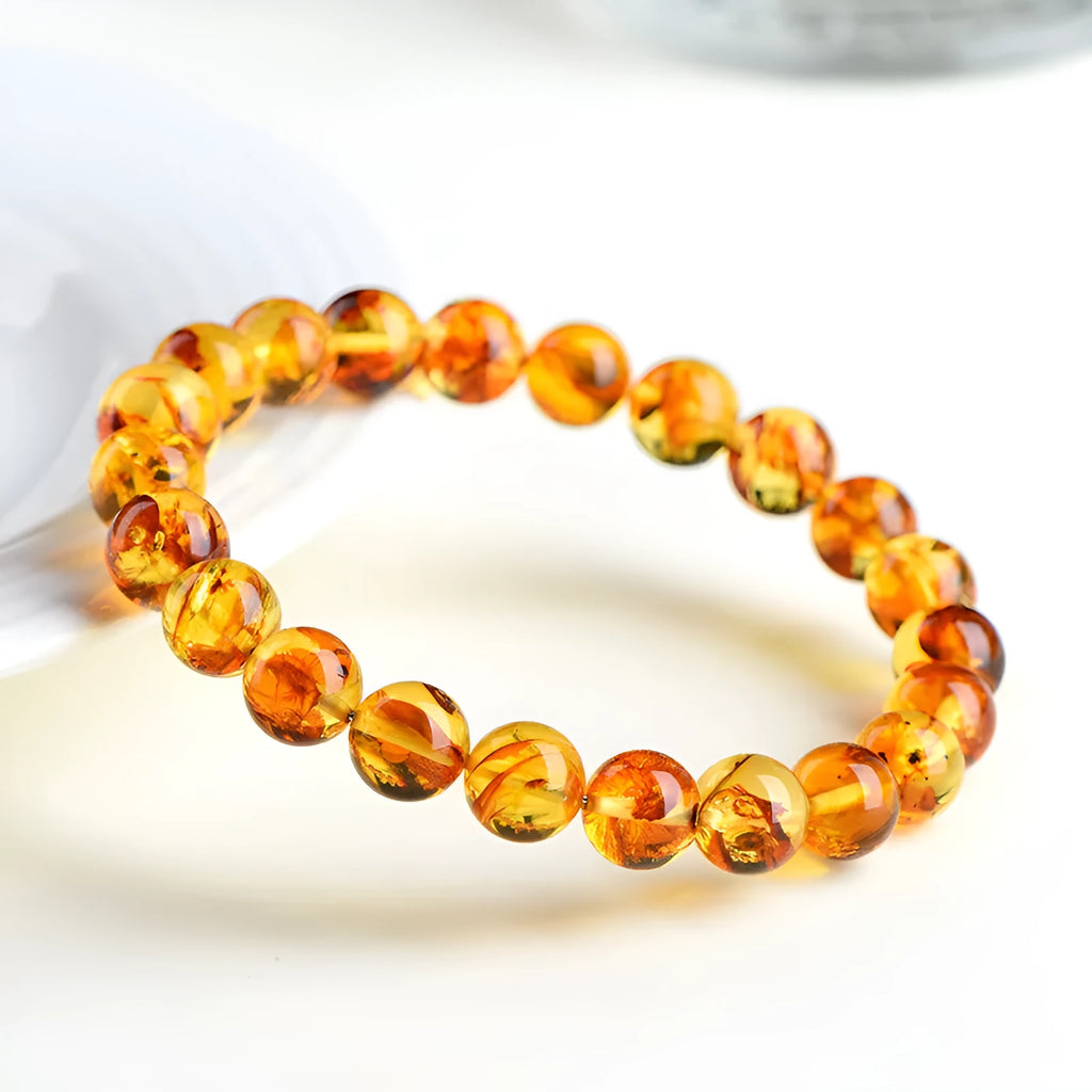 Natural yellow piebald amber bracelet with geometric beads and polished finish