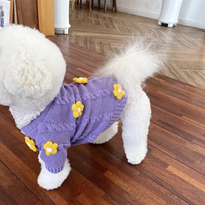 Purple knitted flower print dog coat on a pet showing pull-on style
