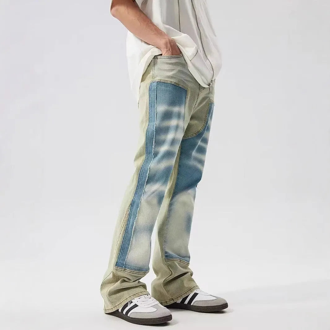 Retro dual-colour yellow and blue patchwork jeans with splash-ink damaged design, mid-waist cut
