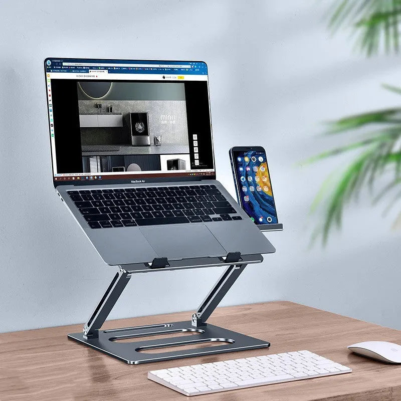 Silver adjustable aluminum laptop stand with laptop on desk at 340mm height