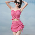 Women's solid colour milk silk bikini swimsuit set with top and pants.