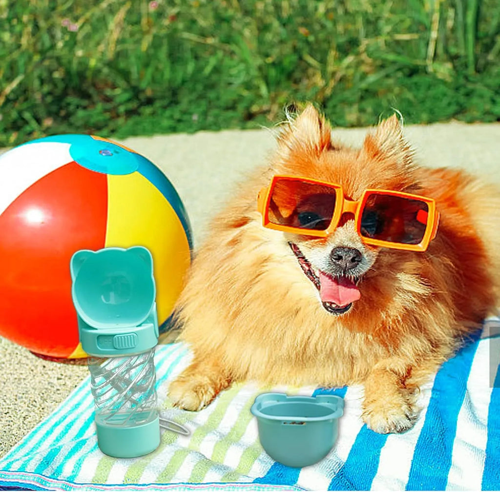 Green 3-in-1 portable pet water bottle with food container and strap, showing rotary switch and bowl.