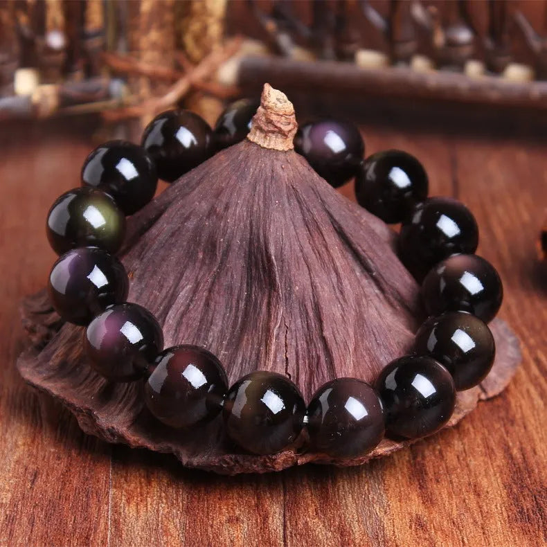 Genuine crystal icy obsidian Pi Xiu bracelet in geometric ethnic style on a neutral background.