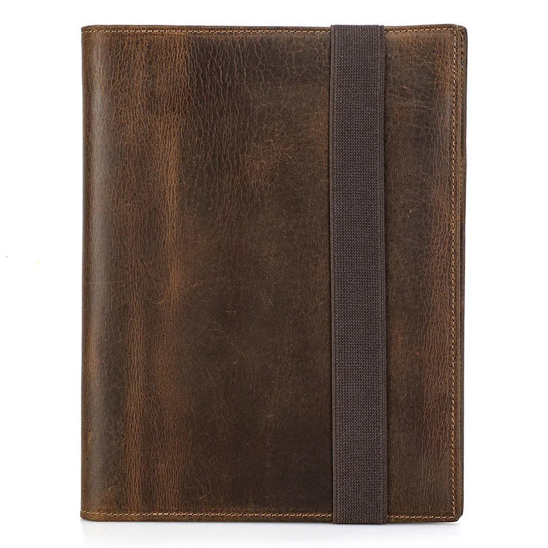 Brown Crazy Horse leather protective sleeve for an A5 notebook, showing square shape and socket closure.